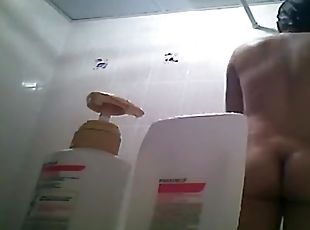 Hairy bush and small tits woman showering