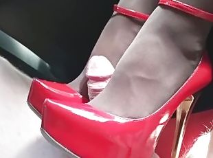 Red high heels and pantyhose shoejob