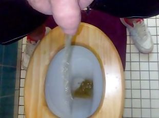 Solo male piss on toilet