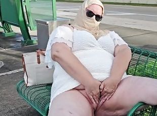 Mature hijab Milf masturbating with big dildo publicly at bus stop with cars passing by