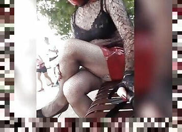 redhead sissy walks on the quays of the Seine and shows off her clit on a bench