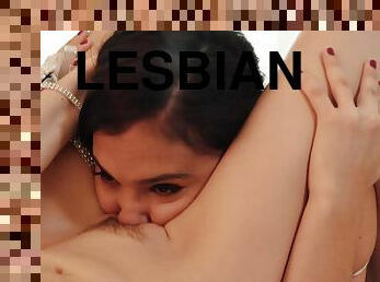 Magnificent lesbians licking passionately on the sofa