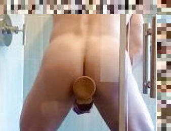 Fit Guy Pegged in Shower by Suction Dildo While Masturbating