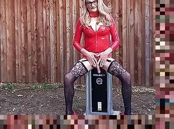 British tranny posing outdoors in PVC