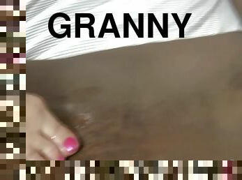 Kinky granny giving footjob