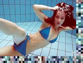 Baby Martina in a tight blue swimsuit in the pool