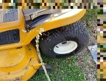 Amateur Brian peeing pissing on a mower to wash it