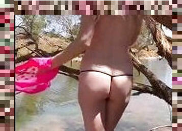 Sexy public outdoor milf stripteases on the river bank