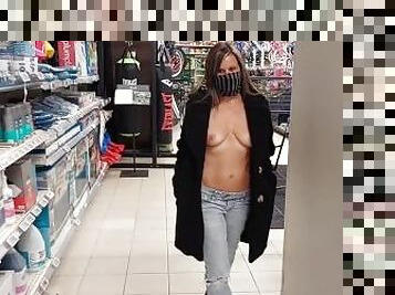 Sexy woman walk without her shirt in stores!