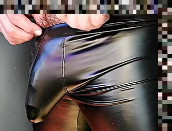 Cock bulge pulsates in tight leather pants