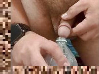 Close up Uncut Hairy Bear Cock Pissing in a Bottle