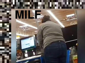 Sexy ass on brunnete milf in jeans at self checkout