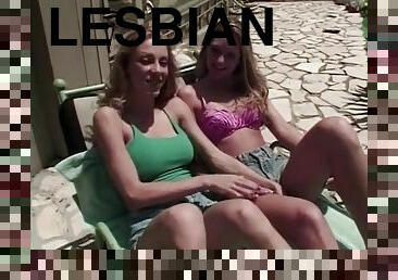 Hot blonde lesbian fucks her friend with strap on in the pool