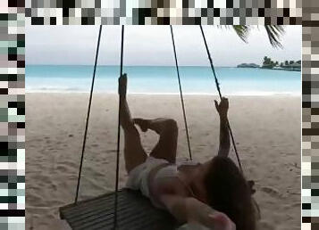Hot Olesya Malibu swings on a swing in the Maldives
