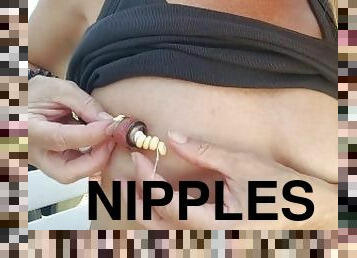 nippleringlover inserting chain with candies through large gauge nipple piercings with nipple tunnel