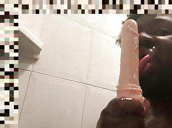 Sucking a didlo sex toy in the shower 