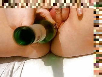 uk milf playing with a hairspray can and a beer bottle