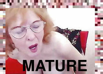 Bespectacled mature woman solo