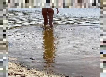 She didn't know about was being filmed. Naked girl on the beach in sexy panties