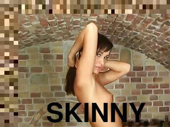 Skinny babe strips in the cellar