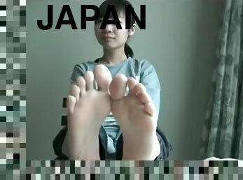 Japanese Removes Stockings To Bare Feet