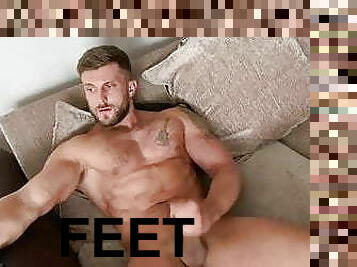 Barefoot muscle hunk Ryan Yule wanking big cock for camera