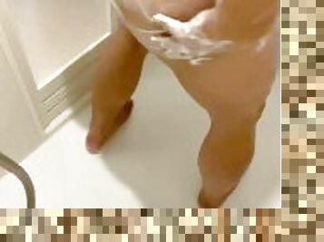 Chubby Asian Daddy bathes in a public shower room