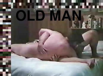 Two old men sucking another