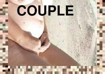 real couple shows off on public beach. my slut pisses topless in front of me so i jerk off