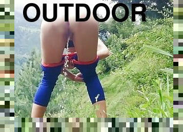 Slim fitness girl in yoga pants pissing Outdoor - Angel Fowler pees in mountains