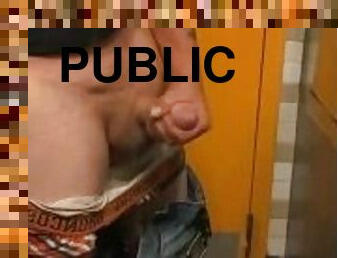 Playing with my cock  in a public restroom