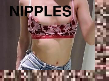 Girl on shopping trying on bras. Pink nipples and cute perfect small boobs