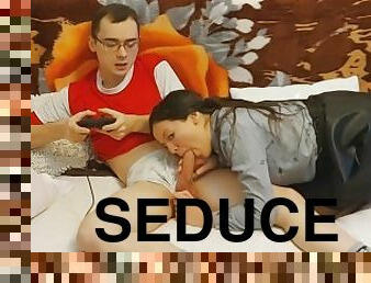 Hot schoolgirl seduces her nerdy classmate while he's playing the playstation
