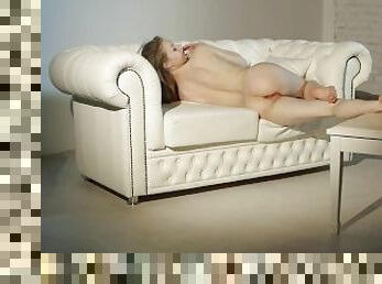 Gorgeous Teen Model Touches Her Body on a White Sofa