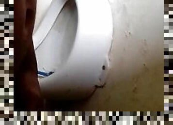 Man pissing in the toilet