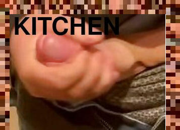 Stroking his big cock in the kitchen