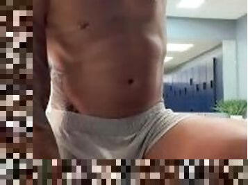 Undressing at the gym looker room