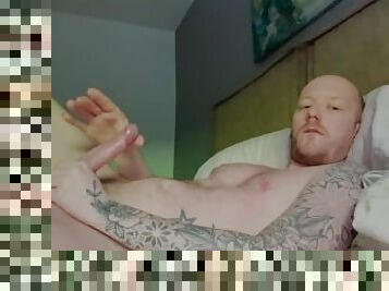 tattooed guy jerks his big dick and blows his load