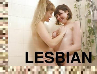 Horny lesbians with natural tits licking in the bathroom