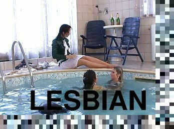 Fully dressed three lesbians in the pool