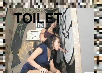 Sexy sluts pleasure a gloryhole cock in toilet
