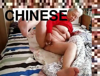 Old Chinese Granny with Big Saggy Tits and Hairy Cunt Creampied by Young Dude