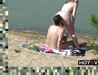 amateur couple makes love on the beach