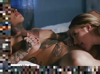 Brunette with tattoos has lesbian sex in the bedroom