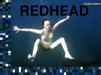 Redheaded girl is so sexy naked in the water