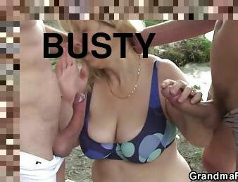 Busty blonde granny double penetration in the beach