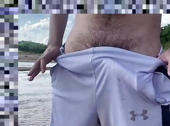 Showing my big cock in public at the river in the forest