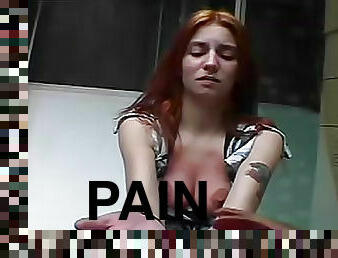 Redhead becomes a pain slut on camera