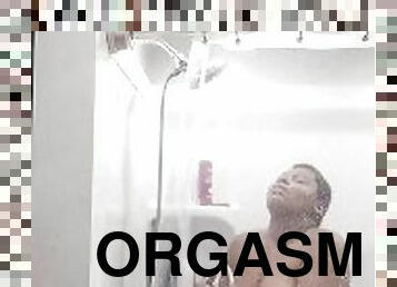 Using the showerhead to cum trying not to scream