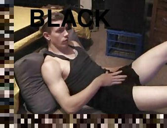 Shane plays with himself over his clothes until his cock is nice and hard. He pulls off his shorts and black panties to expose his horny cock.